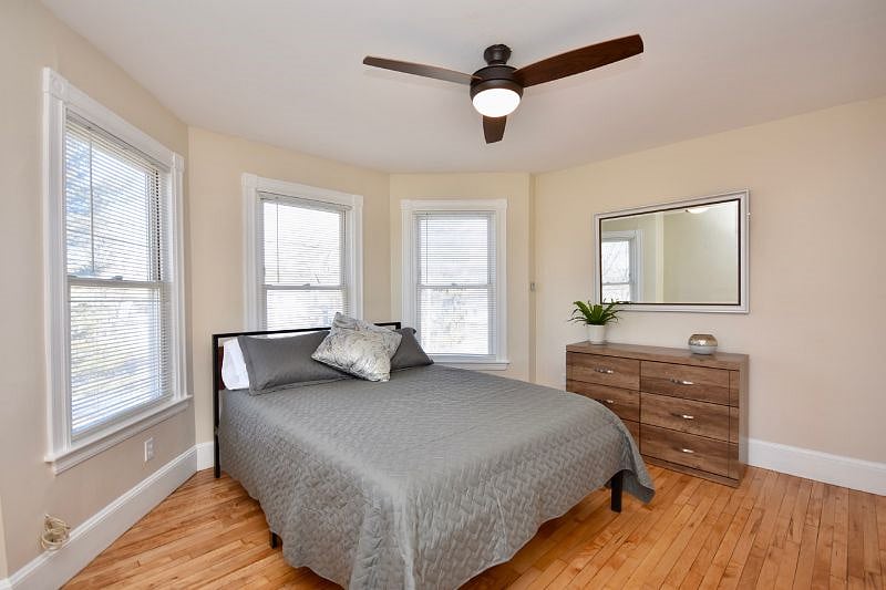 Bedroom with bay window, queen bed, 43" Smart TV,  Payson Park and Back Cove View