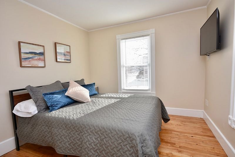 Bedroom with queen bed and 43" Smart TV, Payson Park and Back Cove View
