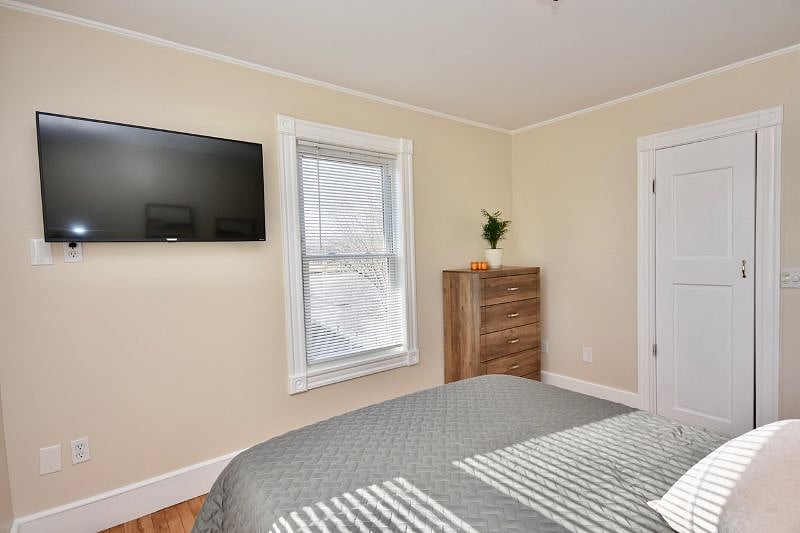Bedroom with queen bed and 43" Smart TV, Payson Park and Back Cove View