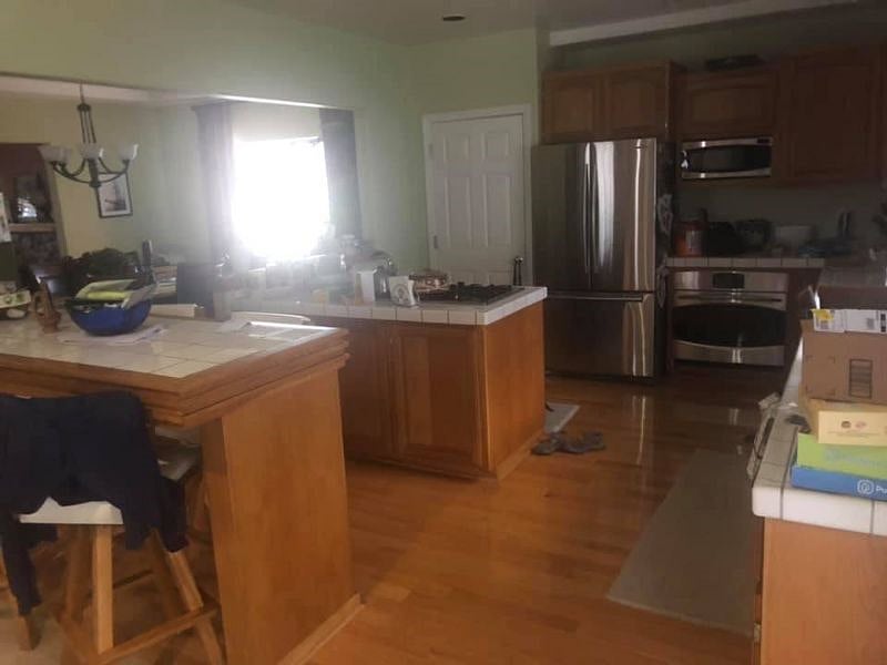 Kitchen with full size refrigerator and gas stove