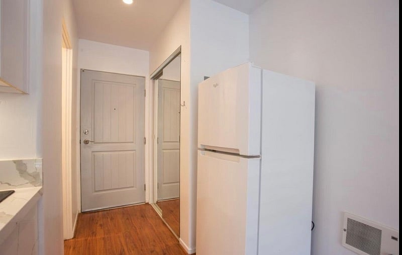 View facing the entrance with closet on right and bathroom on left.