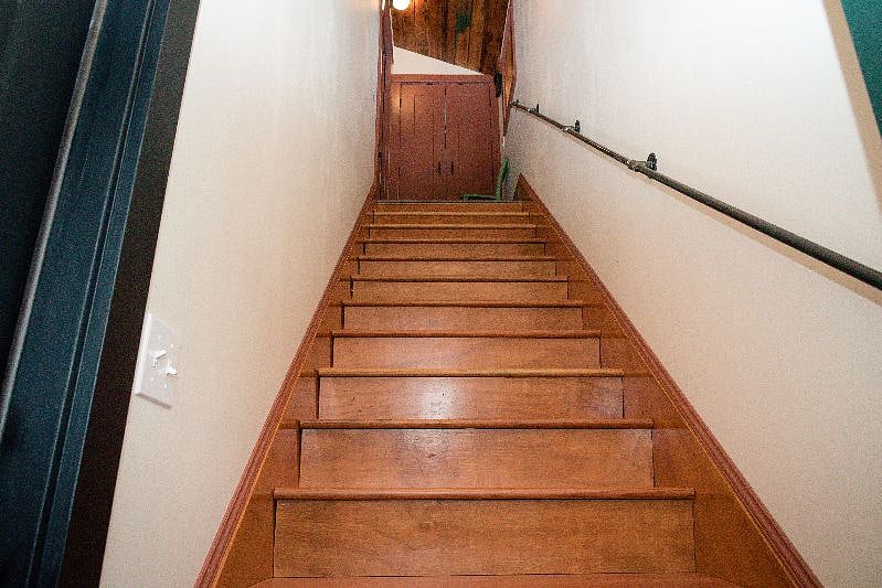 Looking up the Entrance stairs to the top Landing, with coat closet.
