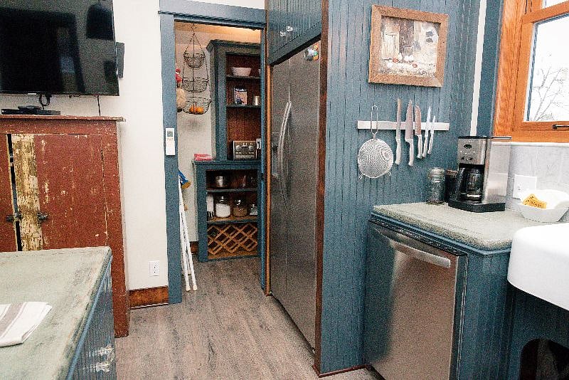 Walk-in Pantry behind pocket door keeps all of your small appliances, cooking tools, cleaning tools, and sundries organized, accessible, and out-of-the-way of daily living, keeping your space in zen mode.