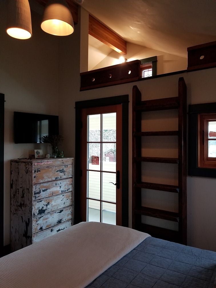 Second smart TV is wall mounted in the bedroom, to watch a movie, or to play a sleep meditation, or morning yoga, on YouTube streaming...