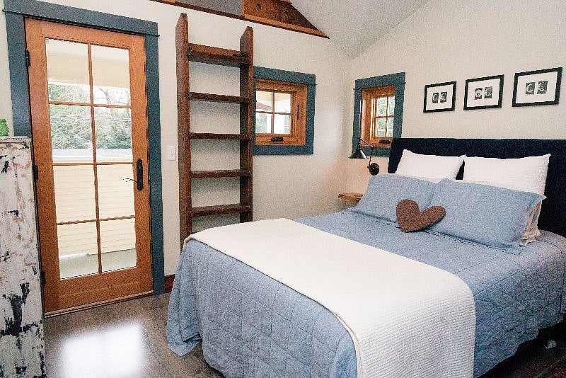 Loft ladder up to the meditation loft space, and french door out to the private balcony.  Tempurpedic queen mattress and pillows, Belgian linen bed coverings and organic cotton sheets in flannel, oxford cloth, or sateen--your choice.