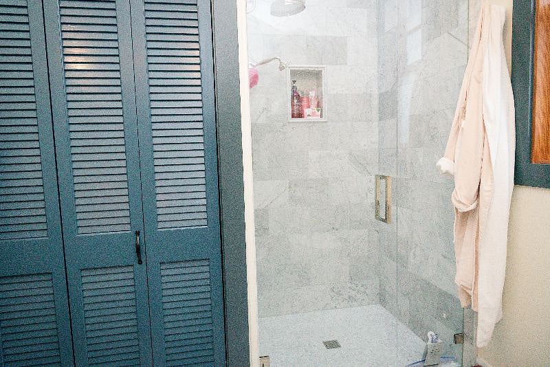 The utility closet containing the high efficiency washer and dryer is adjacent to the shower, within the bath, so dirty clothing does not have to travel far.