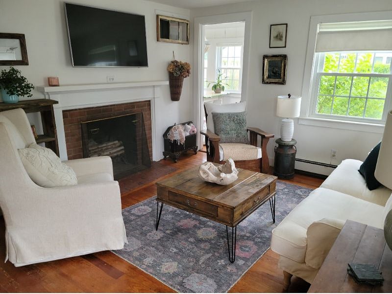 Big TV with Antique Morris Recliner, pull out sofa and Swivel Chair. COMFY!