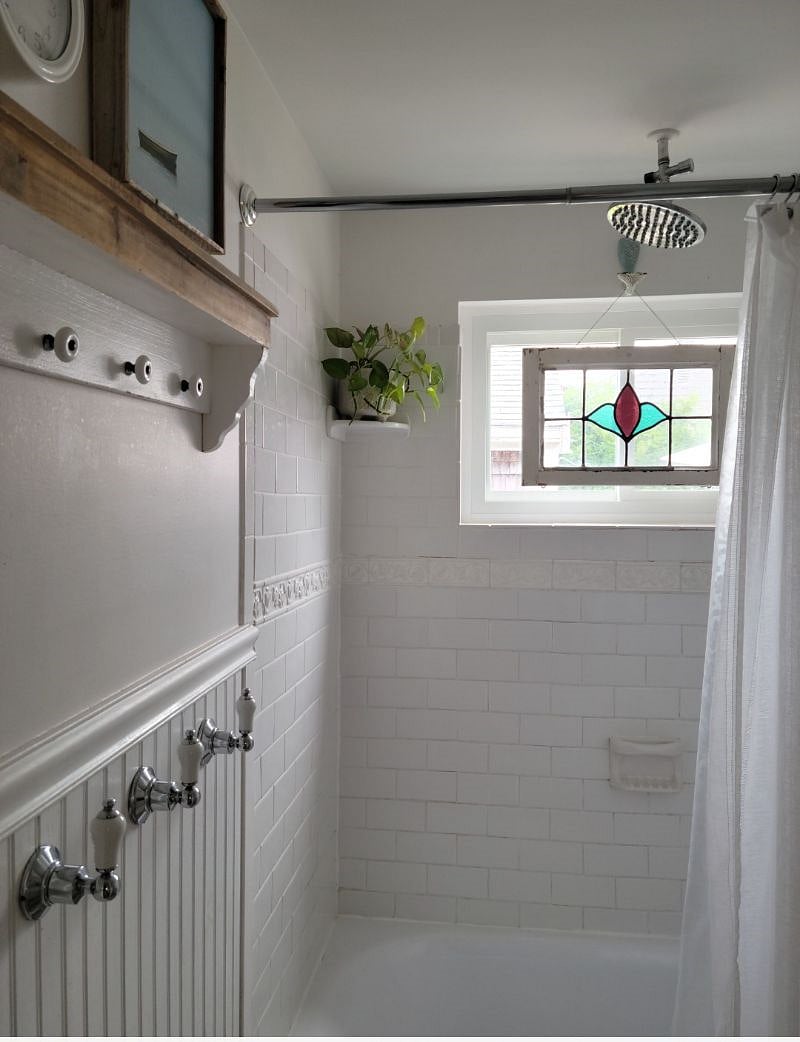 Bright white bathroom shower and new tub