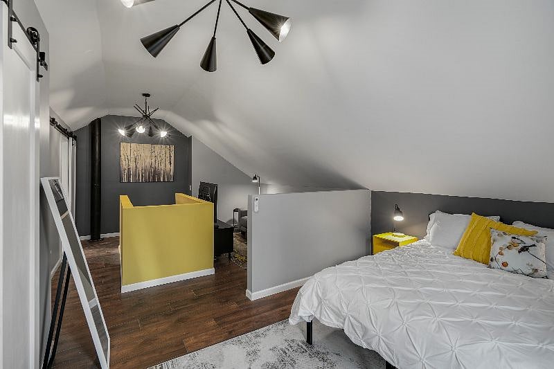 Upstairs loft and lounge space provides a Queen-size bed, bathroom with standing shower, walk in closet and TV/reading nook under vaulted ceilings and dedicated heating/cooling