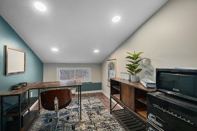 Office with door to keep work separated, includes mini-fridge, microwave and safe