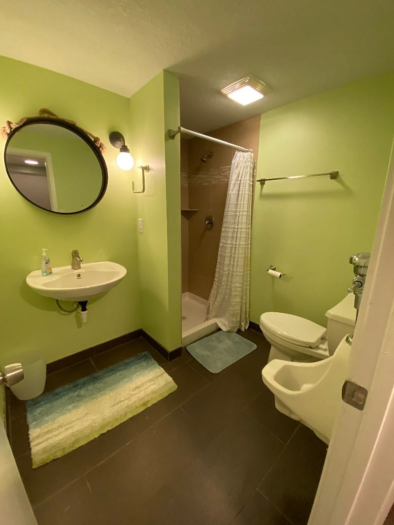 Basement full bathroom with urinal!