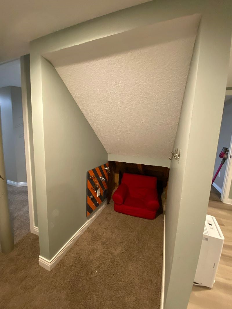 Basement under stairs - kid friendly place to play!