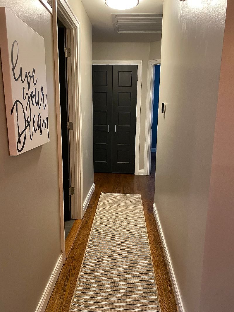 Hallway - bathroom on left and rooms at the end