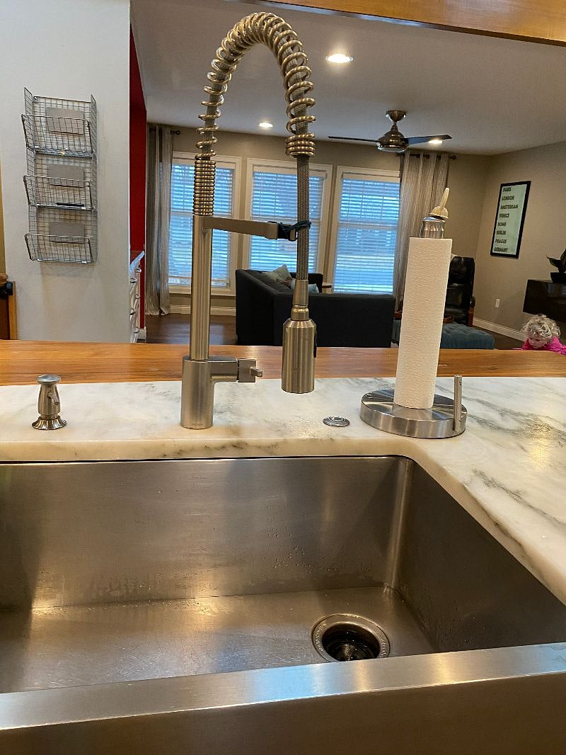Marble and wood countertops with stainless steel sink.