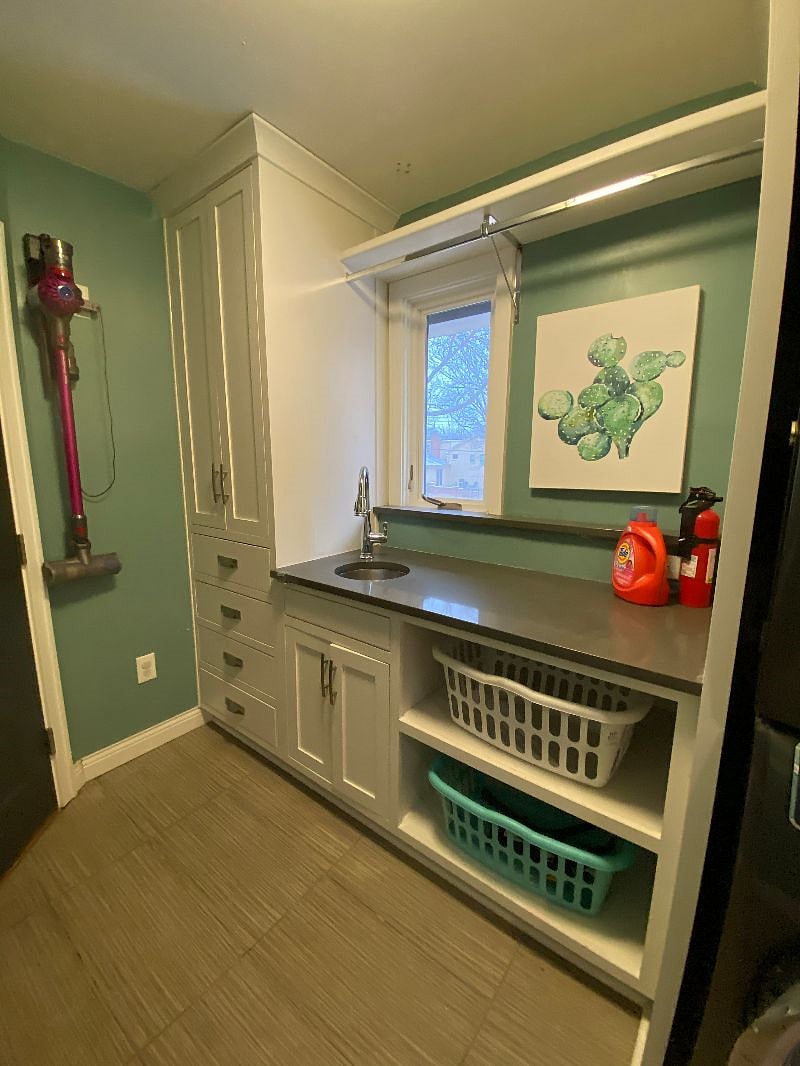 Laundry room with small sink