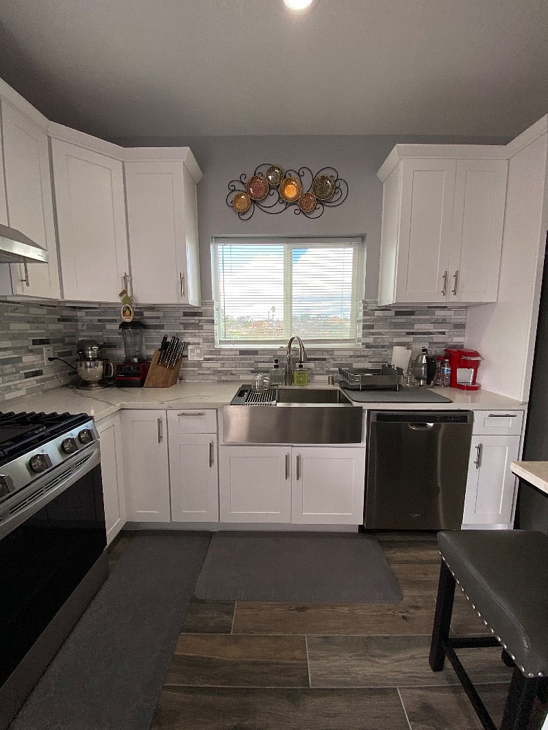 Kitchen, gas stove, sink, Keurig and kettle 