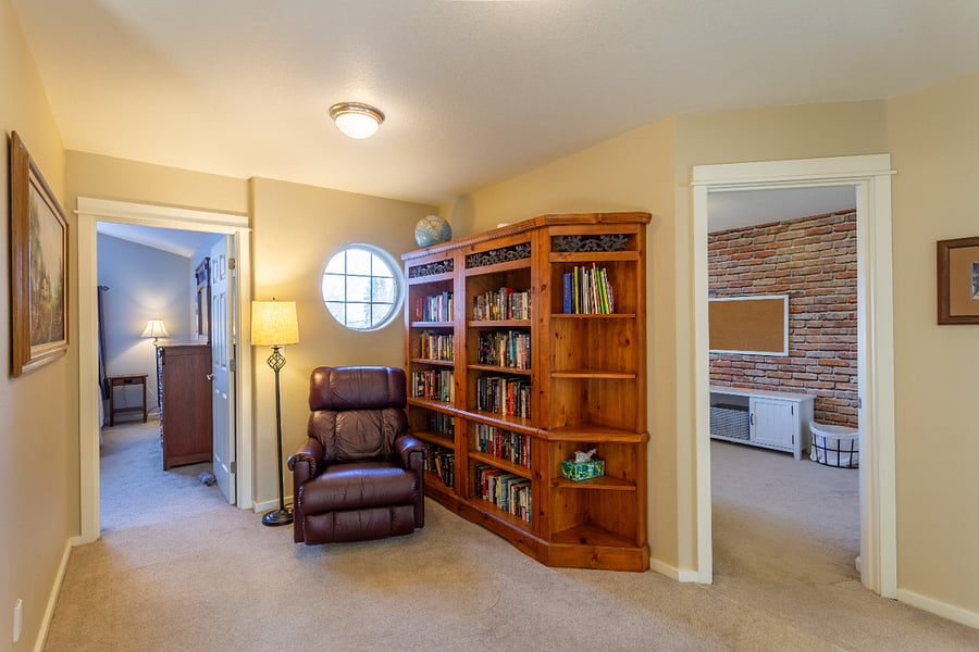 upstairs landing with recliner and extensive personal library