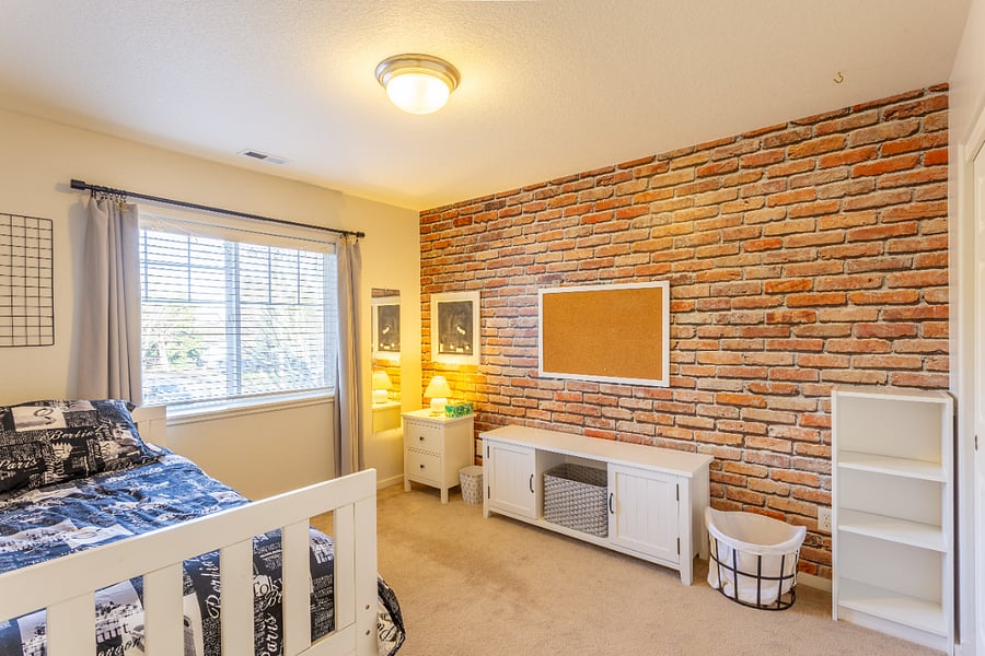 bedroom #3 with twin bed, dresser, side table, storage cabinet/shelves, etc.