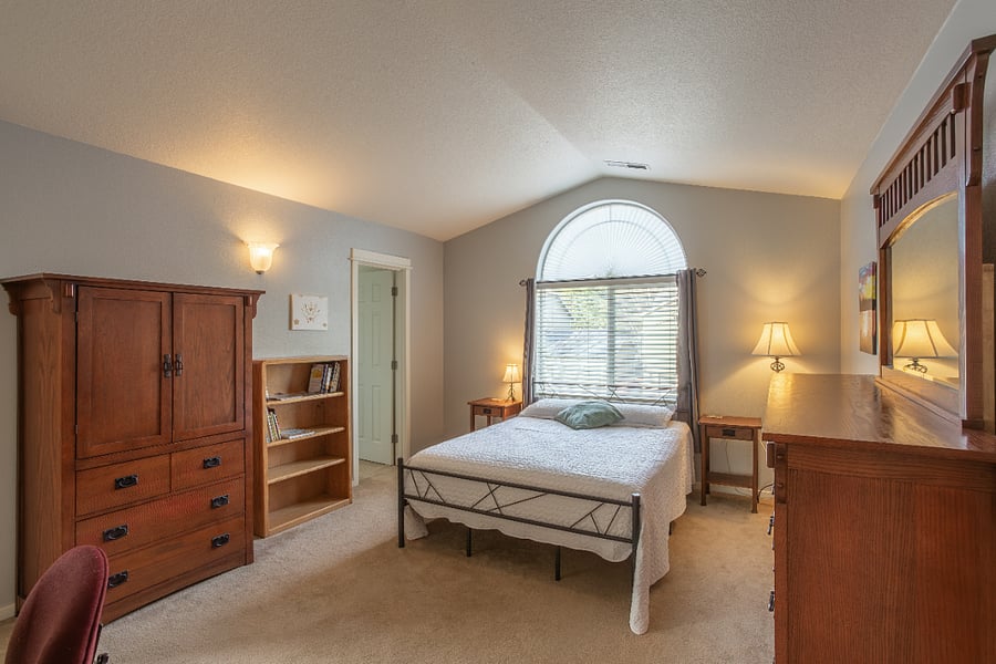 main suite from landing doorway (walk in closet through visible door on left; bathroom door not visible)