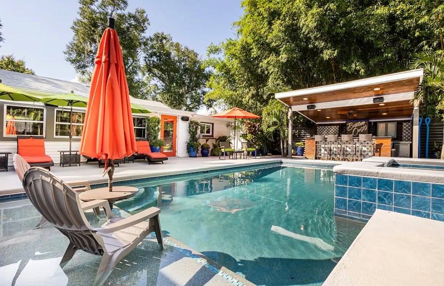 Outdoor kitchen, bar, resort style saltwater pool and jacuzzi  shared with home. Relax and enjoy!