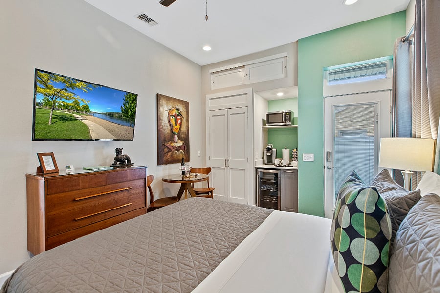 Large bedroom with private entrance and huge walk-in shower and bathroom in the room. Beverage center, closet, king size bed. Designer furnished. Short cut to the pool.