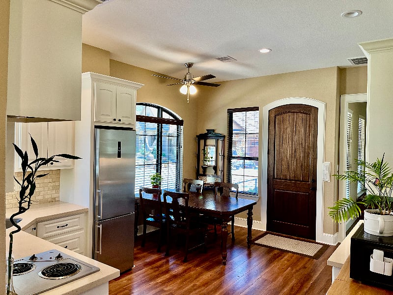 Spacious kitchen, very bright and cheery, ceiling fan. Kitchen door opens to large porch overlooking front yard.
