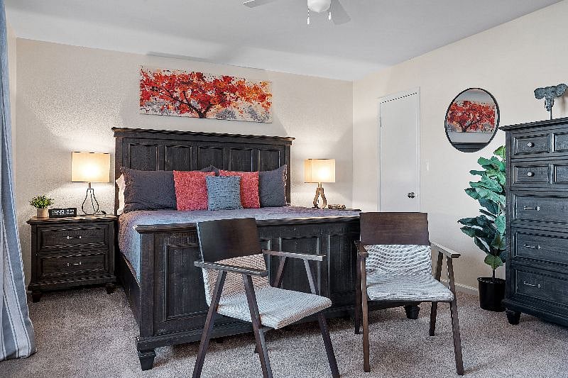 Primary bedroom with king sized bed and walk in closet