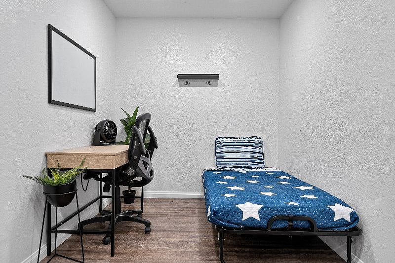 You will find the roll-a-way bed and extra amenities in the office