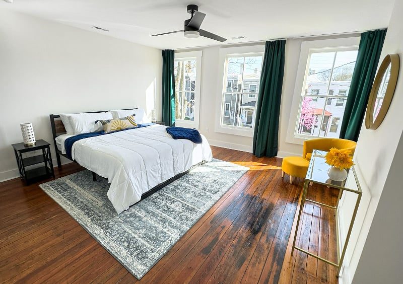 Primary Bedroom w/ blackout curtains