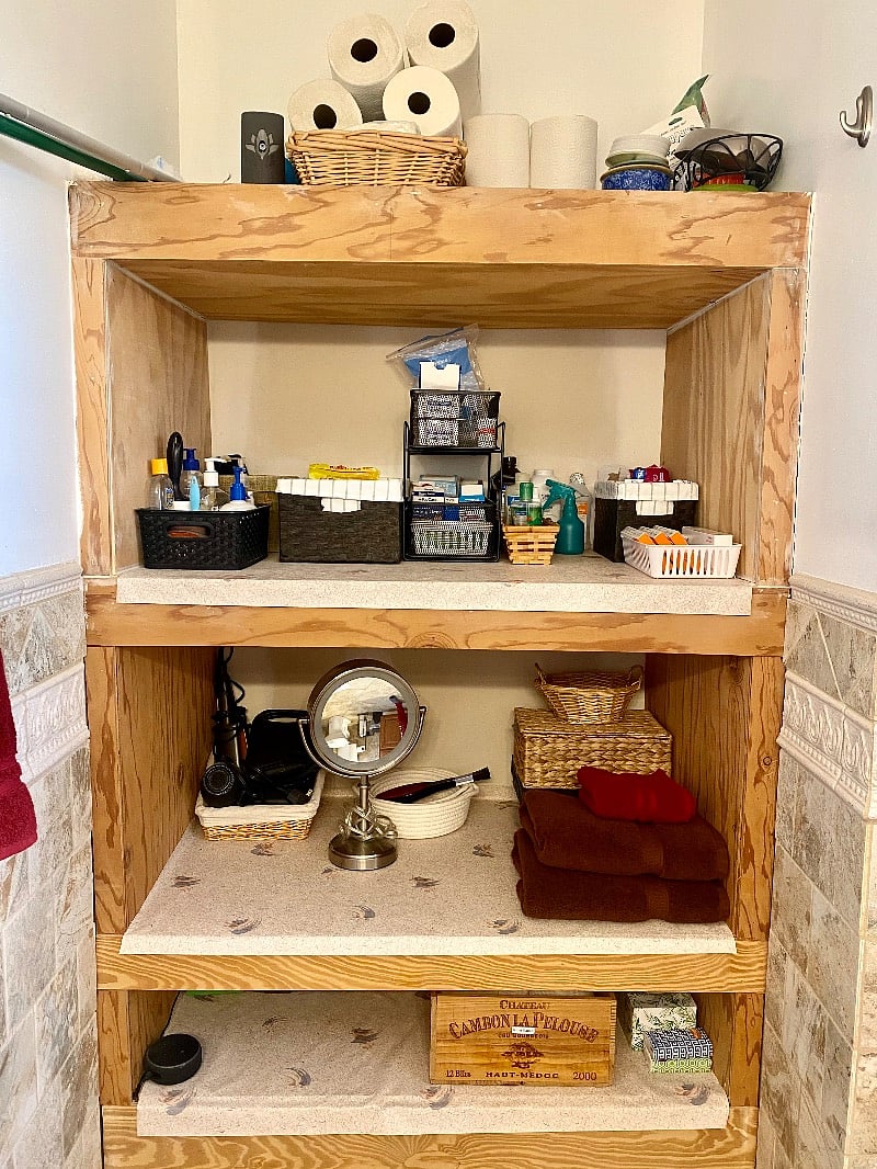 Downstairs bathroom with plentiful storage and toiletries, first aid supplies, and hair dryer and straightener included