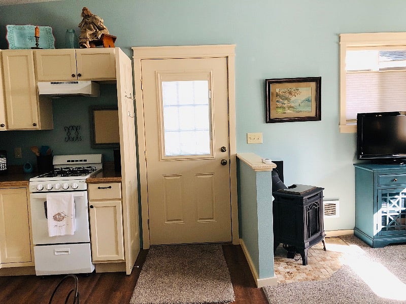 Front door. Kitchen on left, living room on right.