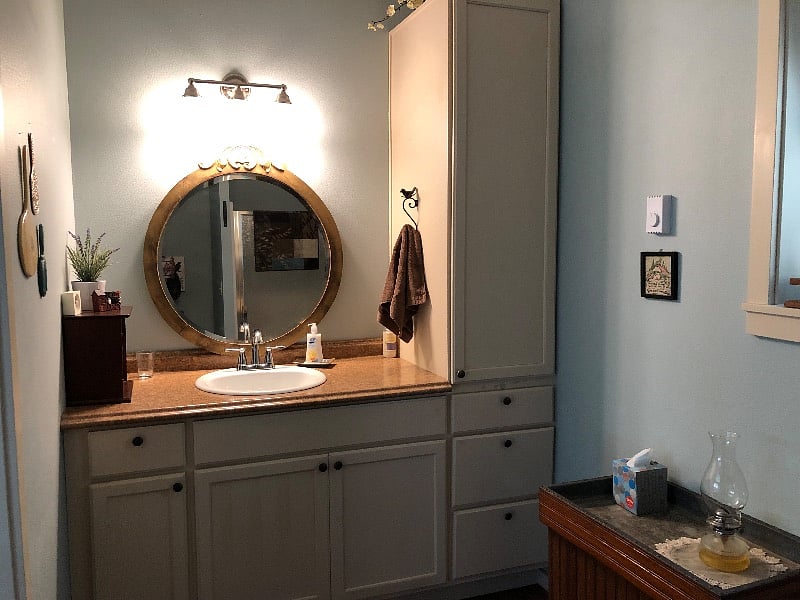 Vanity in bath w/ storage next to it