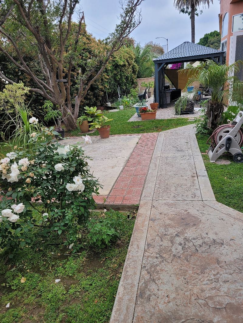 Backyard is block wall enclosed. Canopt, canopy, and bbq
