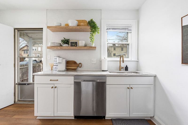 Modern, fully stocked kitchen, with Keurig coffee maker.