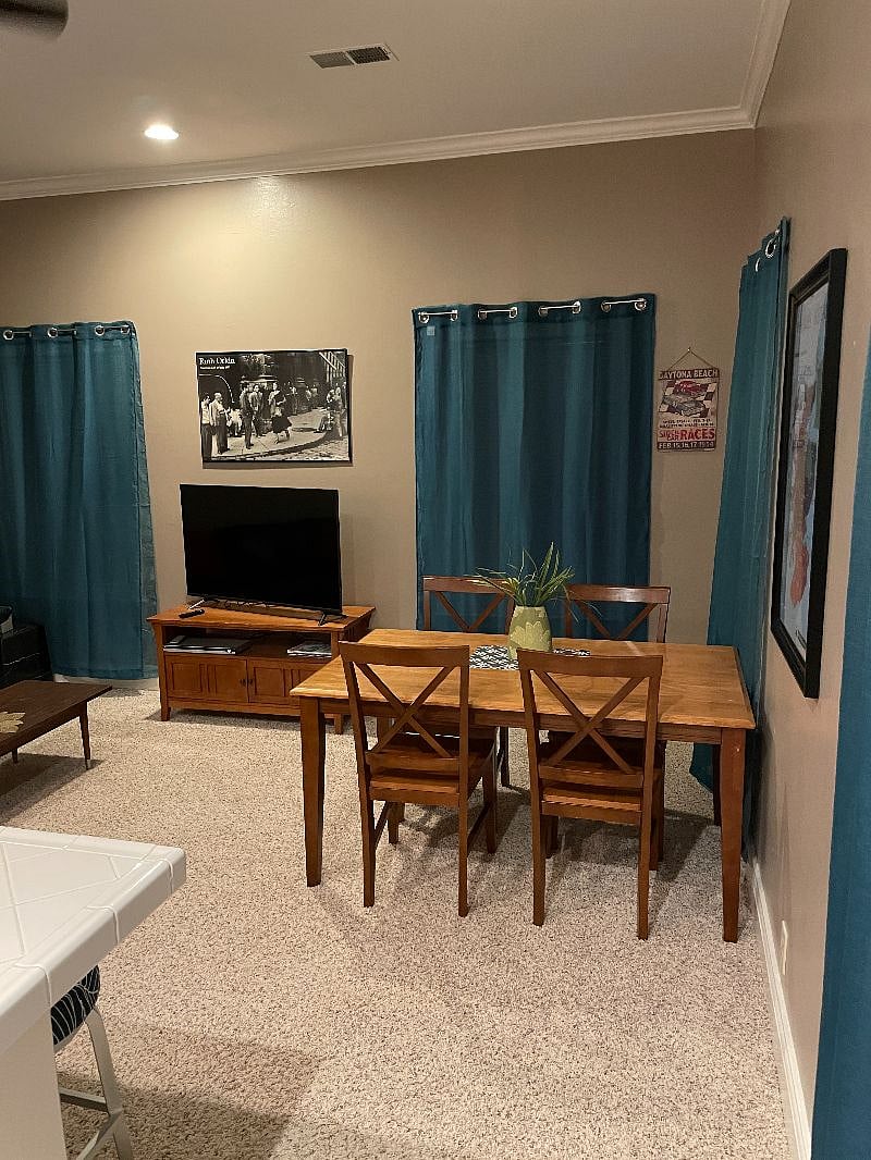 Dining table and living room TV