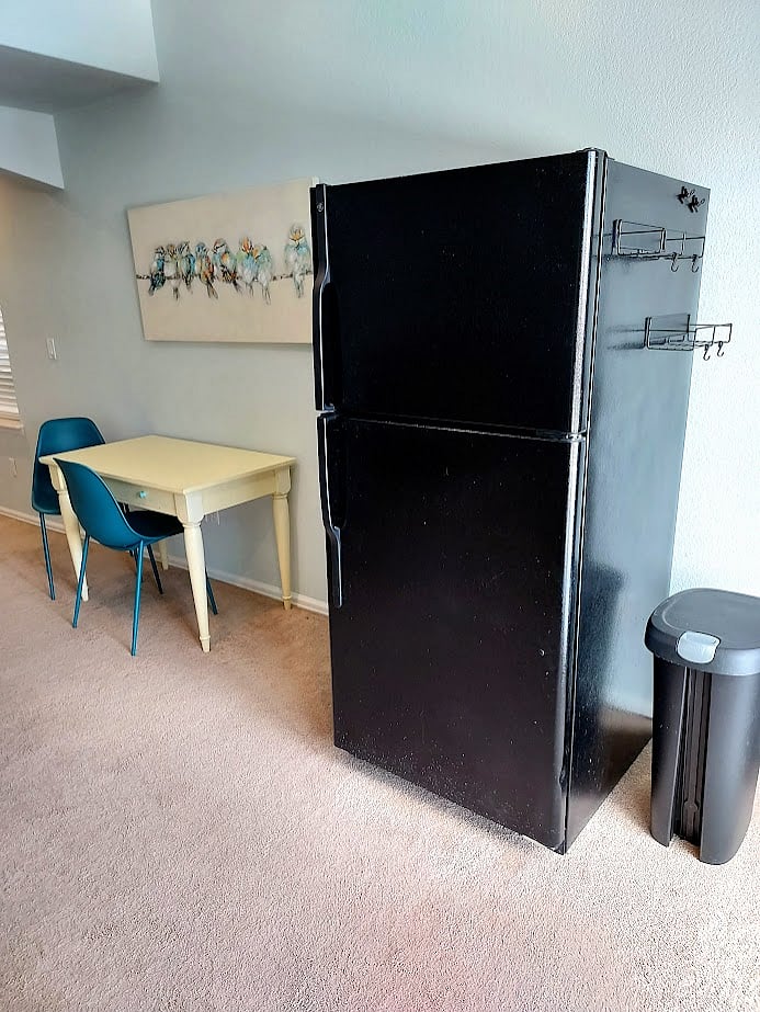 eating area with full-sized fridge