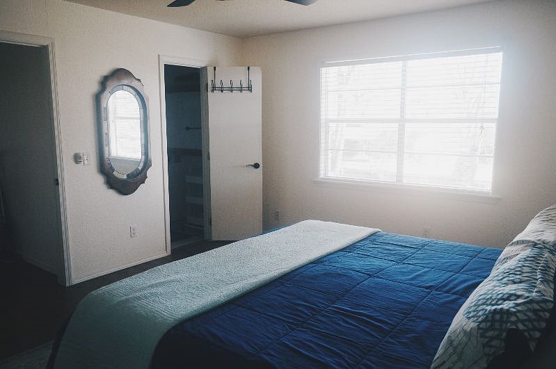 1. Master Bedroom with King bed and east facing window overlooking the backyard
