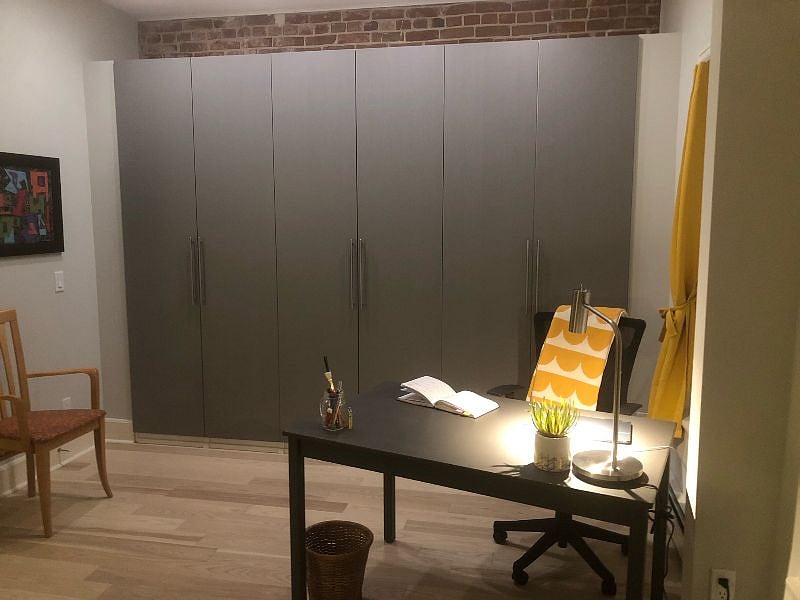 Bedroom office area with storage