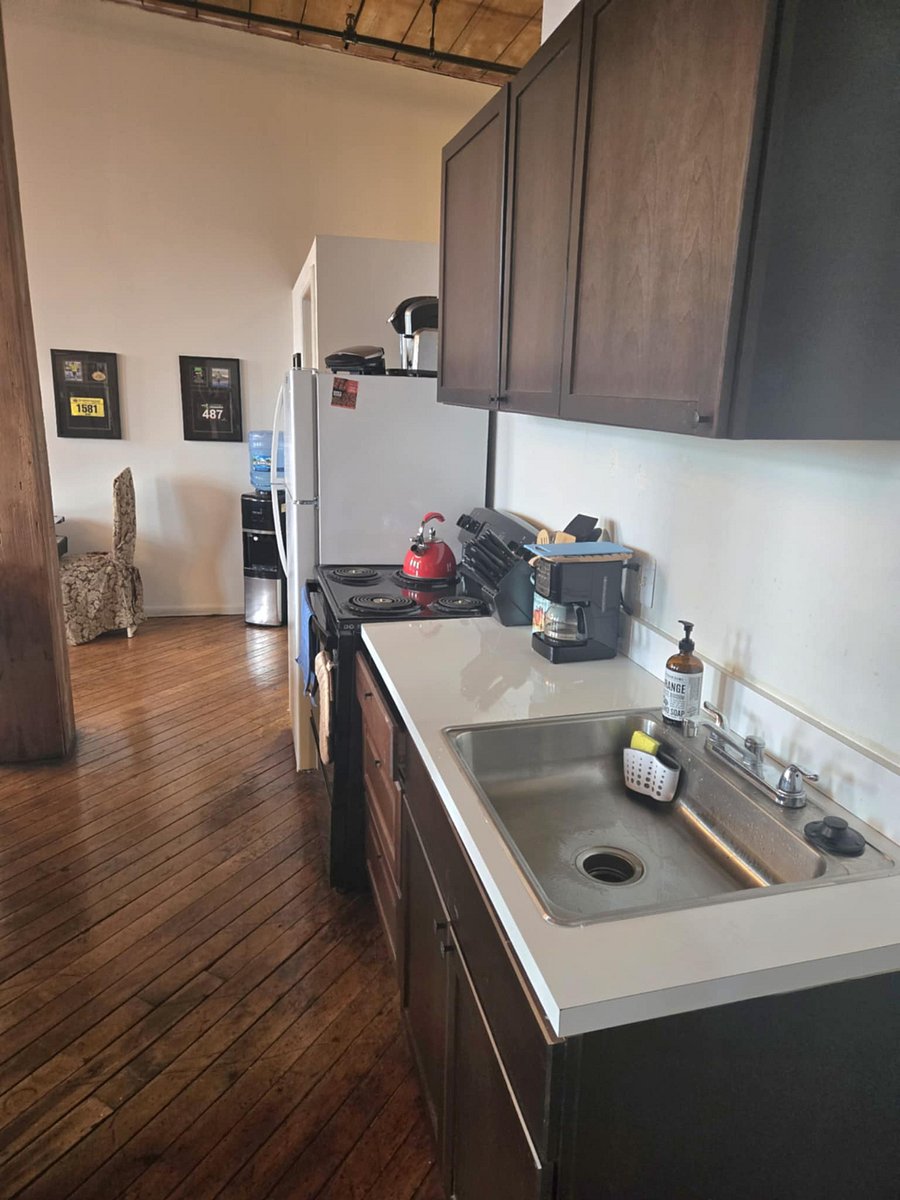 Kitchen with Stoveand Oven, Microwave, and Full Refrigerator