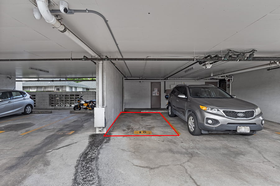 Assigned and secured parking for one car. Trash located right behind stall.