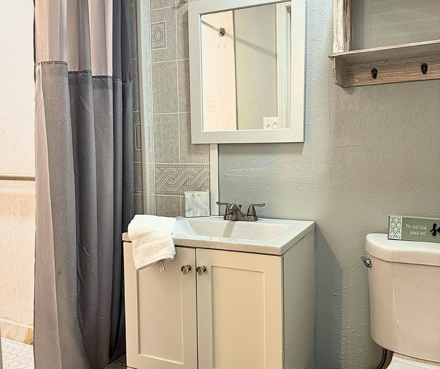 Ensuite bathroom with fresh towels, storage, and all the essentials for your stay.