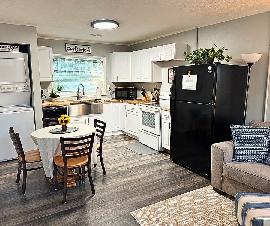 Bright open-concept living with full kitchen, comfy seating, and smart layoutperfect for extended stays or working professionals.