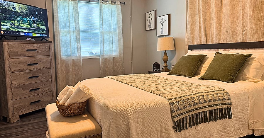 Relax in the plush Queen bed with hotel-quality linens. Ensuite bathroom and blackout curtains for restful nights.