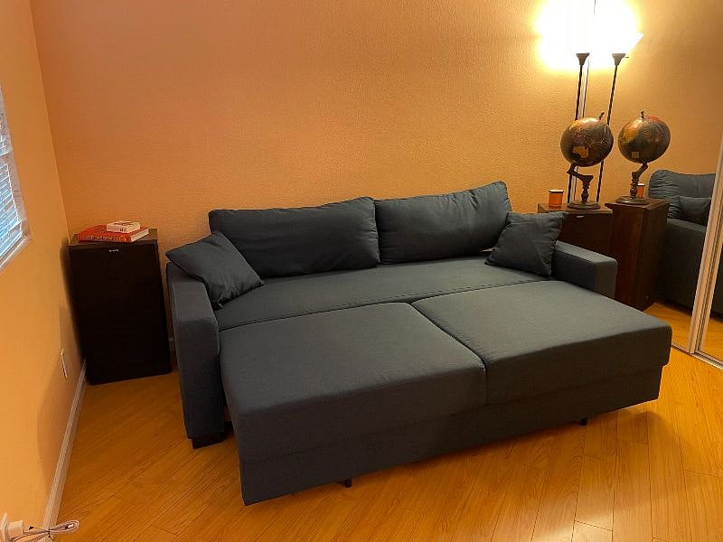 Futon unfolds into a Full sized bed, very comfortable. An extra queen sized mattress is also available in the closet and fits atop this once unfolded