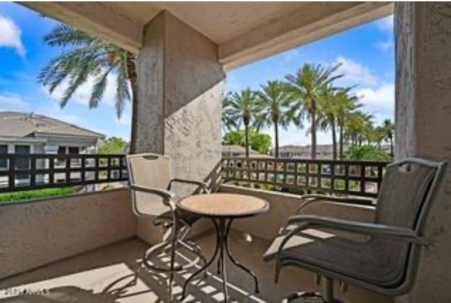 Balcony overlooking pool and golf course