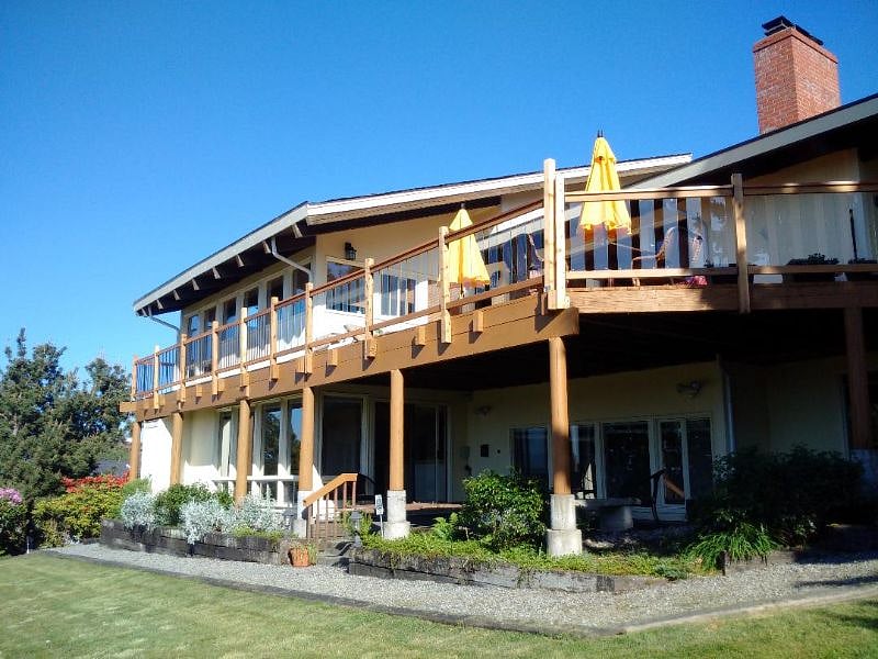 The lower level is our spacious apartment, in a garden setting. Private entrance. Private patio.