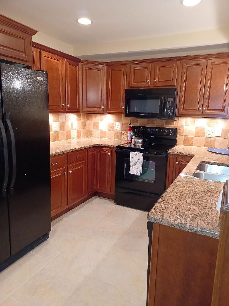 Cherry cabinets, granite counters, full size refrigerator and ample storage.
