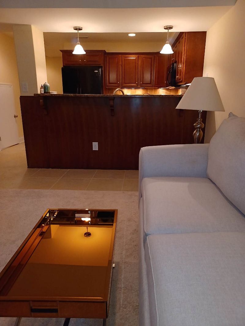 View of kitchen from carpeted
 side room
