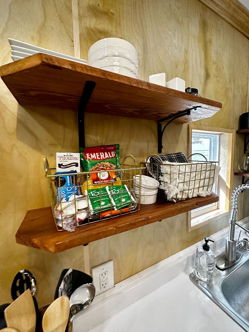 Kitchen shelving for easy access. We have included a little starter kit with snacks, coffee, tea, sugar, stevia, salt & pepper.