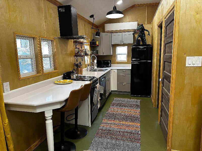 Alley kitchen with white quartz countertops, all new appliances, full size dishwasher, plenty of cabinet space and all the tools, pots and pans you need for a perfect meal.